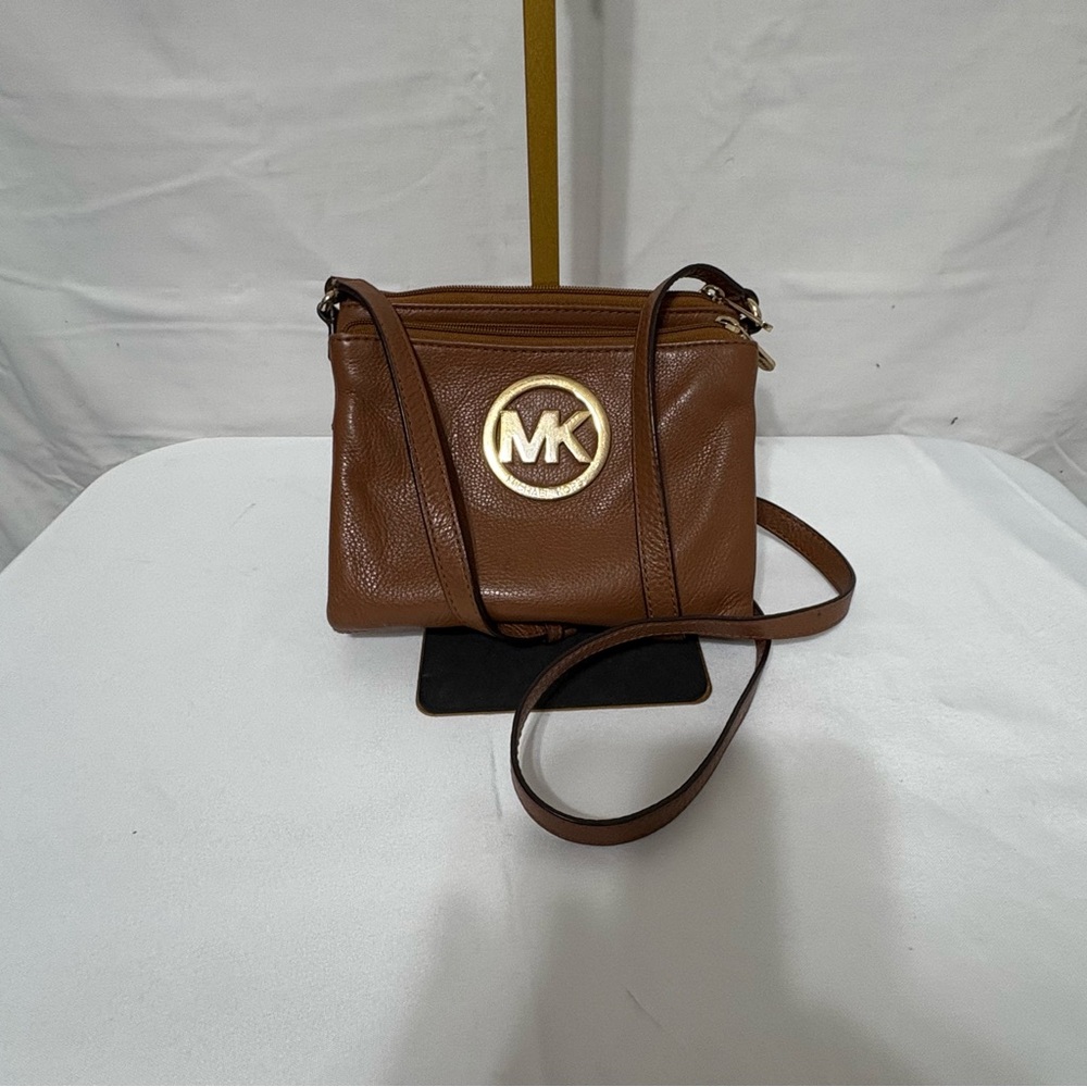 Michael Kors brown leather crossbody bag with gold-tone hardware
